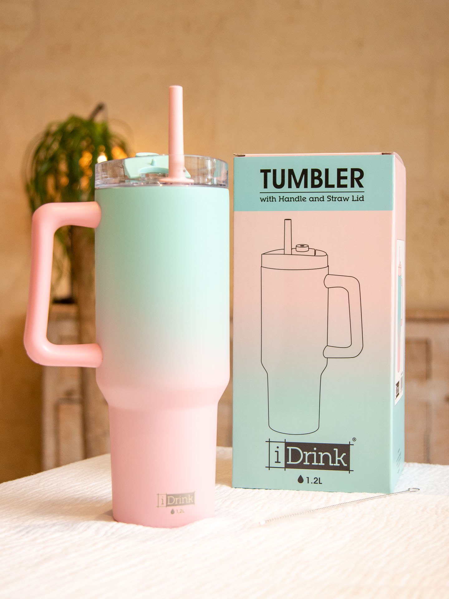 Image illustrative de l'article "Travel Mug – Bleu/Rose"