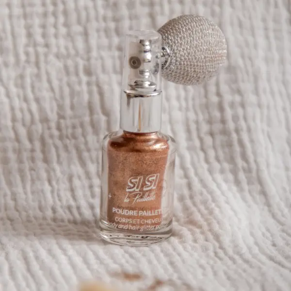 Image illustrative de l'article "Spray Poudre Pailletée – Bronze"